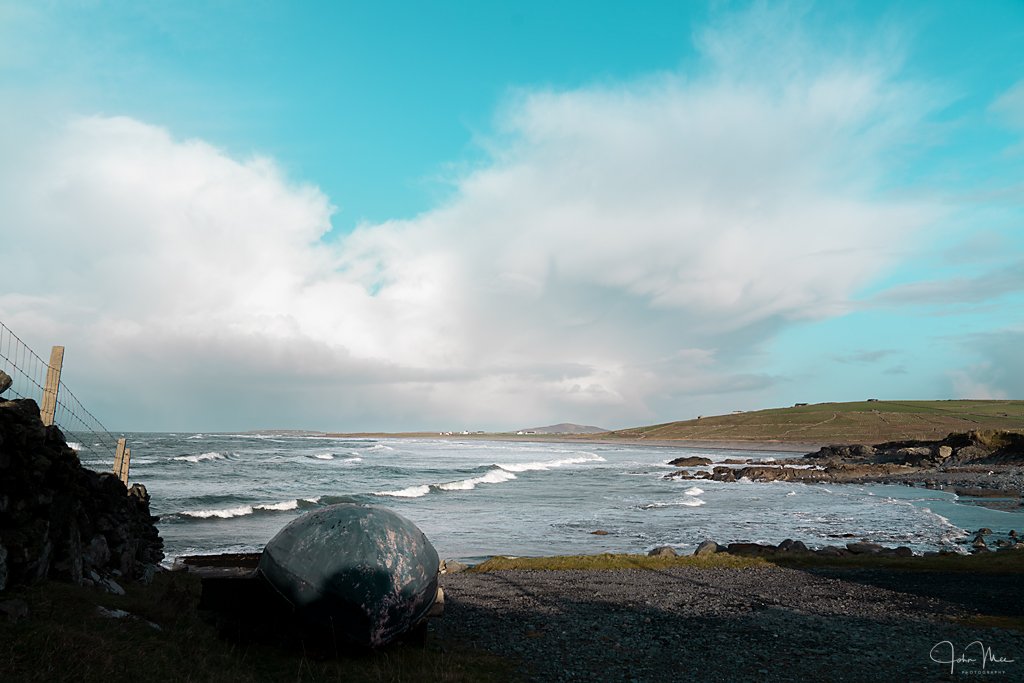 A currach lies at the coast at the Lost Valley